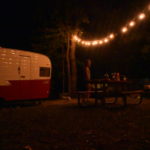 retro camper campsite at night