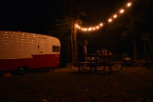 retro camper campsite at night